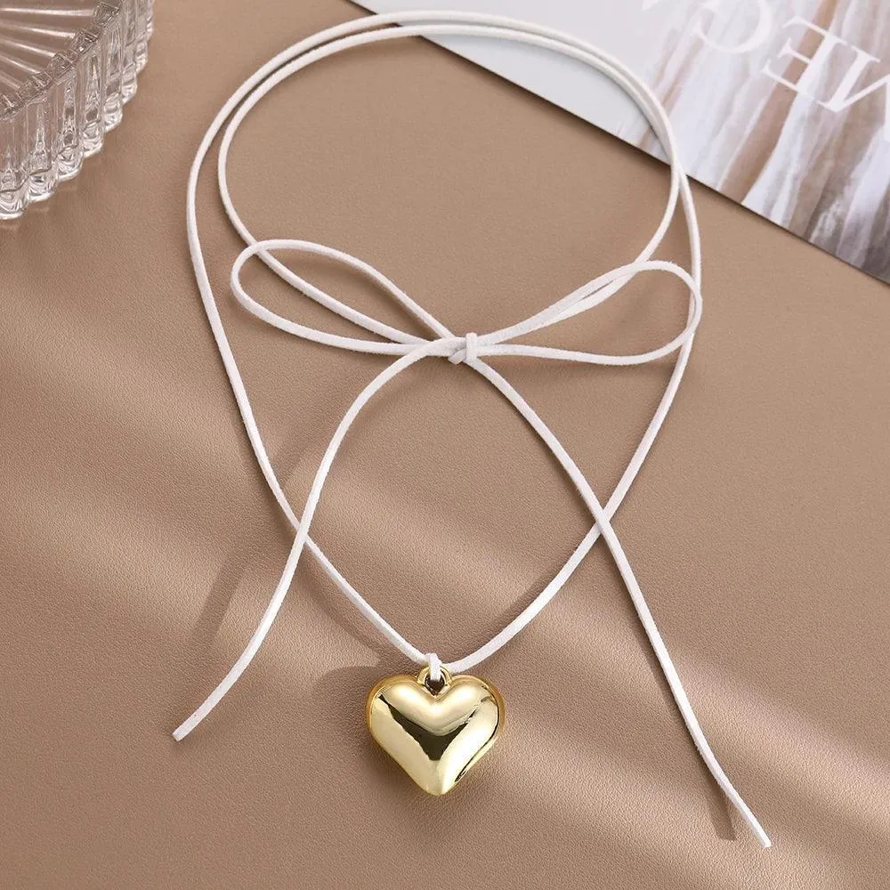 Heart Velvet Choker Necklace: Gothic Bow Detail for Edgy Style