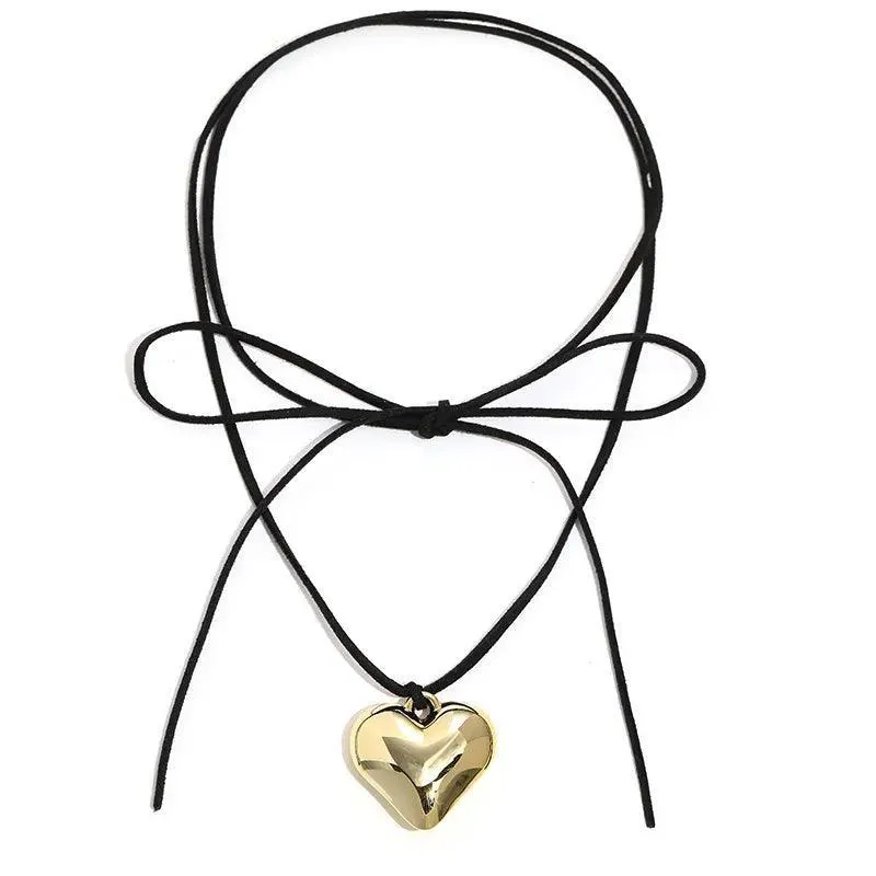 Heart Velvet Choker Necklace: Gothic Bow Detail for Edgy Style