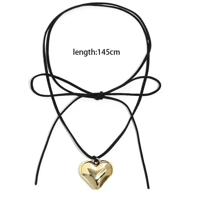 Heart Velvet Choker Necklace: Gothic Bow Detail for Edgy Style